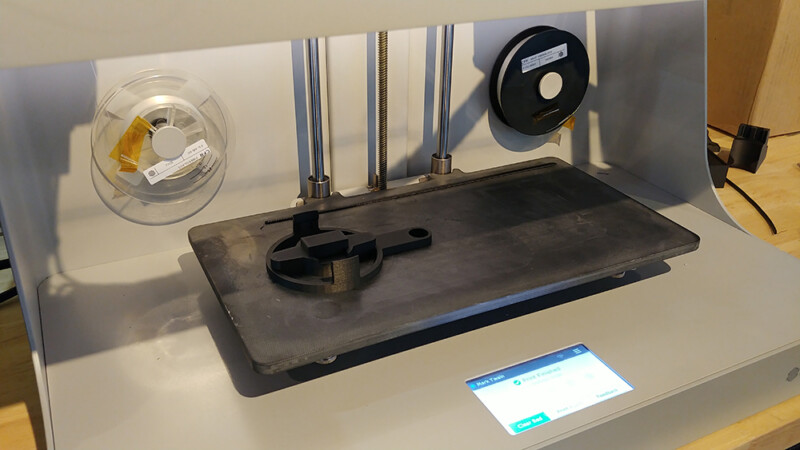 Image of 3D printed Jeep top removal tool in print bed of Markforged Desktop Series 3D printer.